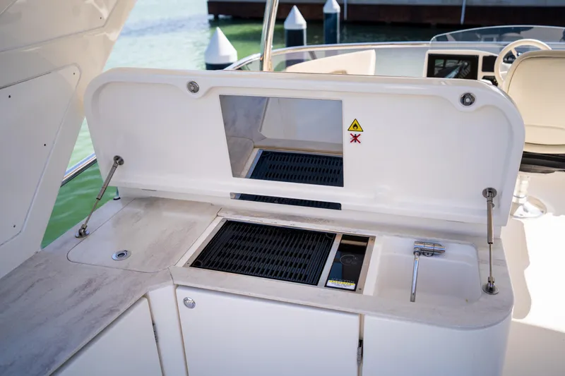 Forever Young Yacht Photos Pics Outdoor kitchen on 2018 Absolute 58 Navetta yacht with grill and sink.