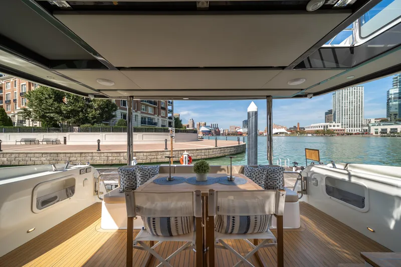 Forever Young Yacht Photos Pics Luxurious 2018 Absolute 58 Navetta yacht interior with waterfront city view.