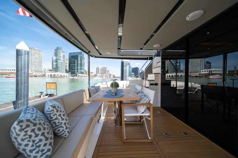 Forever Young Yacht Photos Pics Luxurious 2018 Absolute 58 Navetta yacht deck with city skyline view.