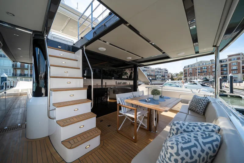 Forever Young Yacht Photos Pics Luxurious 2018 Absolute 58 Navetta yacht interior with elegant seating and dining area.