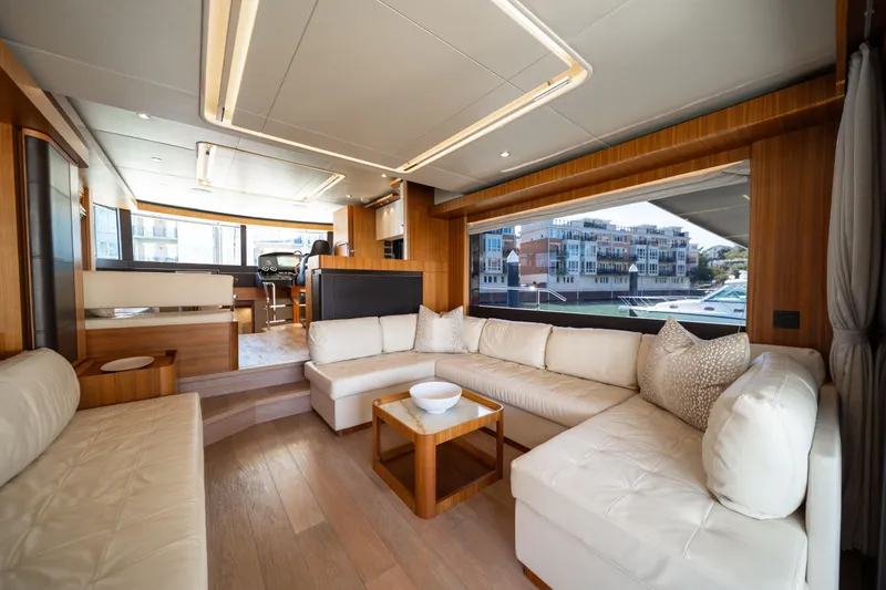 Forever Young Yacht Photos Pics Luxurious interior of 2018 Absolute 58 Navetta yacht with elegant seating and modern design.