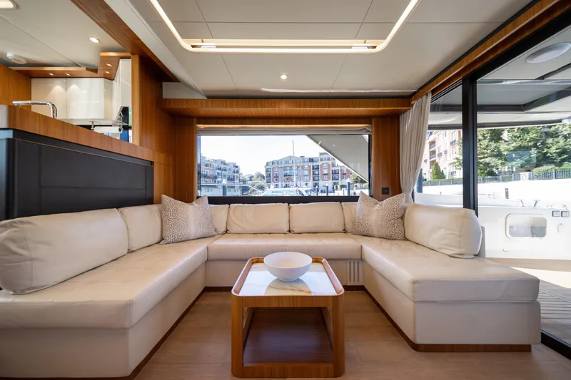 Forever Young Yacht Photos Pics Luxurious interior of 2018 Absolute 58 Navetta yacht with elegant seating and modern design.