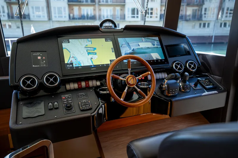 Forever Young Yacht Photos Pics Cockpit of 2018 Absolute 58 Navetta yacht with advanced navigation controls and displays.