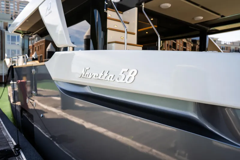 Forever Young Yacht Photos Pics 2018 Absolute 58 Navetta yacht docked, showcasing sleek design and modern features.