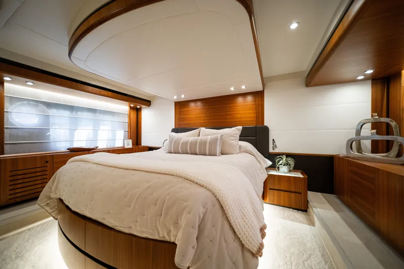 Forever Young Yacht Photos Pics Luxurious bedroom interior of 2018 Absolute 58 Navetta yacht with modern wood accents.
