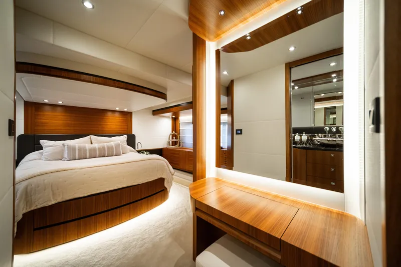 Forever Young Yacht Photos Pics Luxurious bedroom interior of 2018 Absolute 58 Navetta yacht with elegant wood finishes.