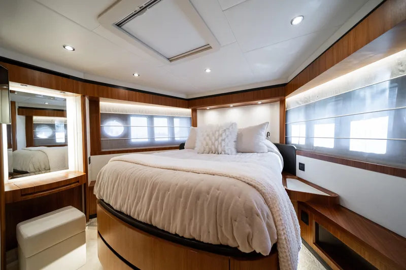 Forever Young Yacht Photos Pics Luxurious bedroom interior of 2018 Absolute 58 Navetta yacht with elegant wood finishes.