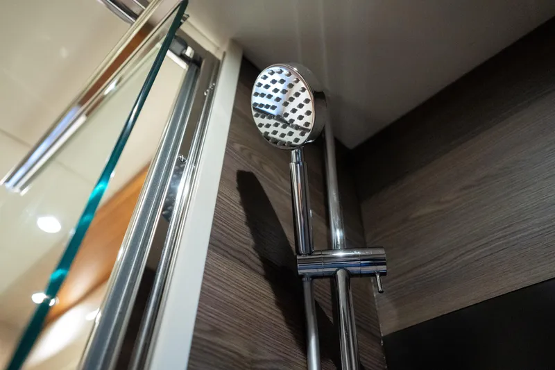 Forever Young Yacht Photos Pics Showerhead in 2018 Absolute 58 Navetta yacht bathroom, featuring modern chrome design.