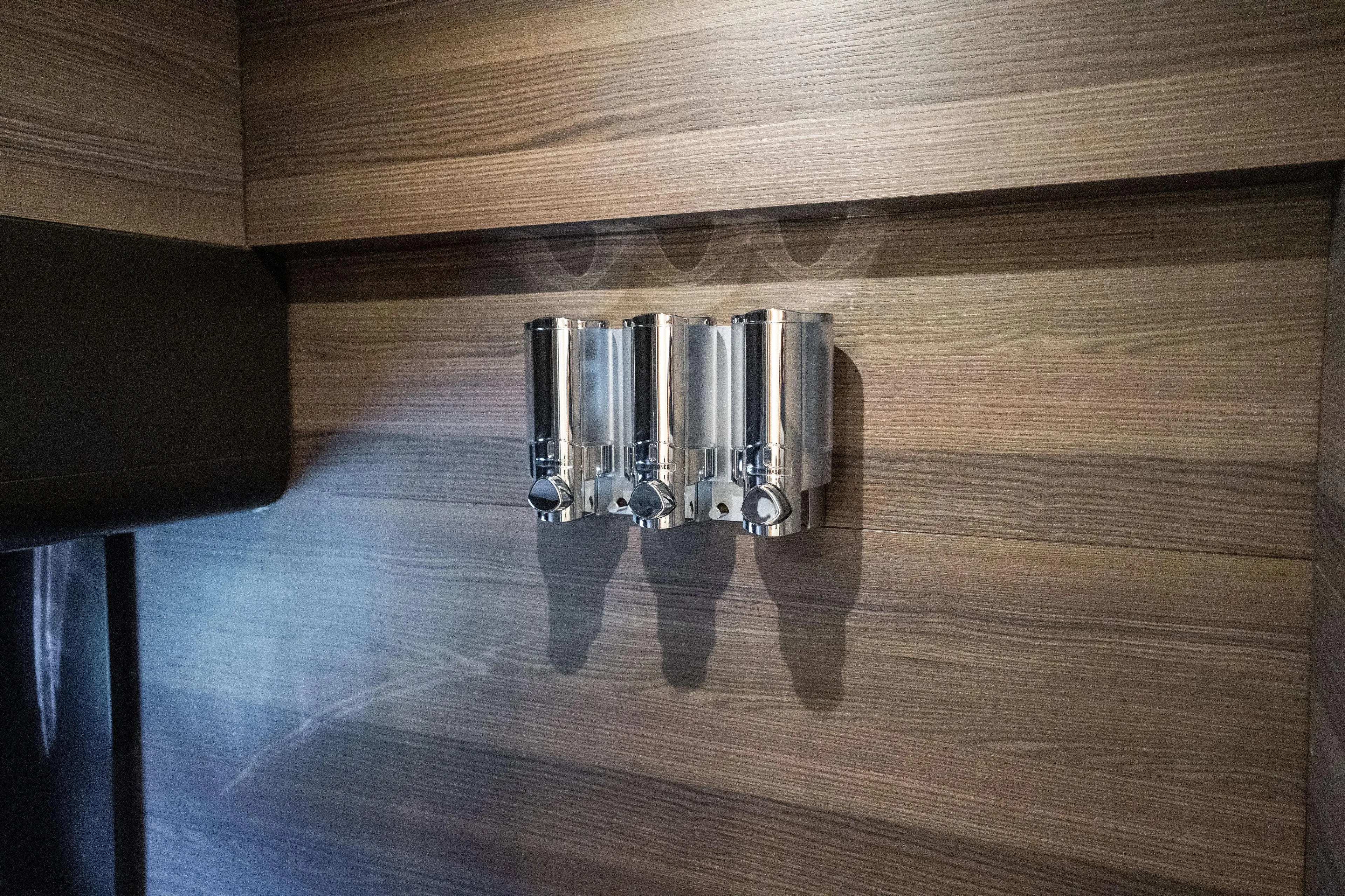 Forever Young Yacht Photos Pics Wall-mounted chrome dispensers on Absolute 58 Navetta yacht, 2018 model.