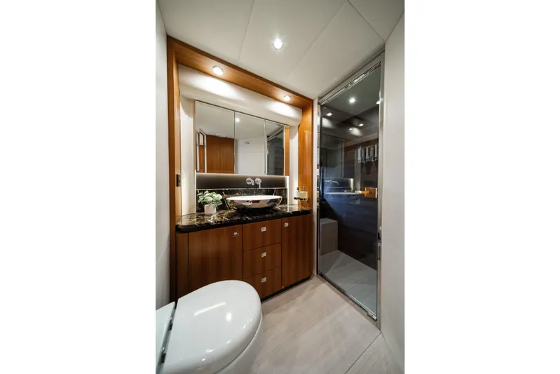 Forever Young Yacht Photos Pics Luxurious bathroom interior of 2018 Absolute 58 Navetta yacht with modern fixtures and elegant design.