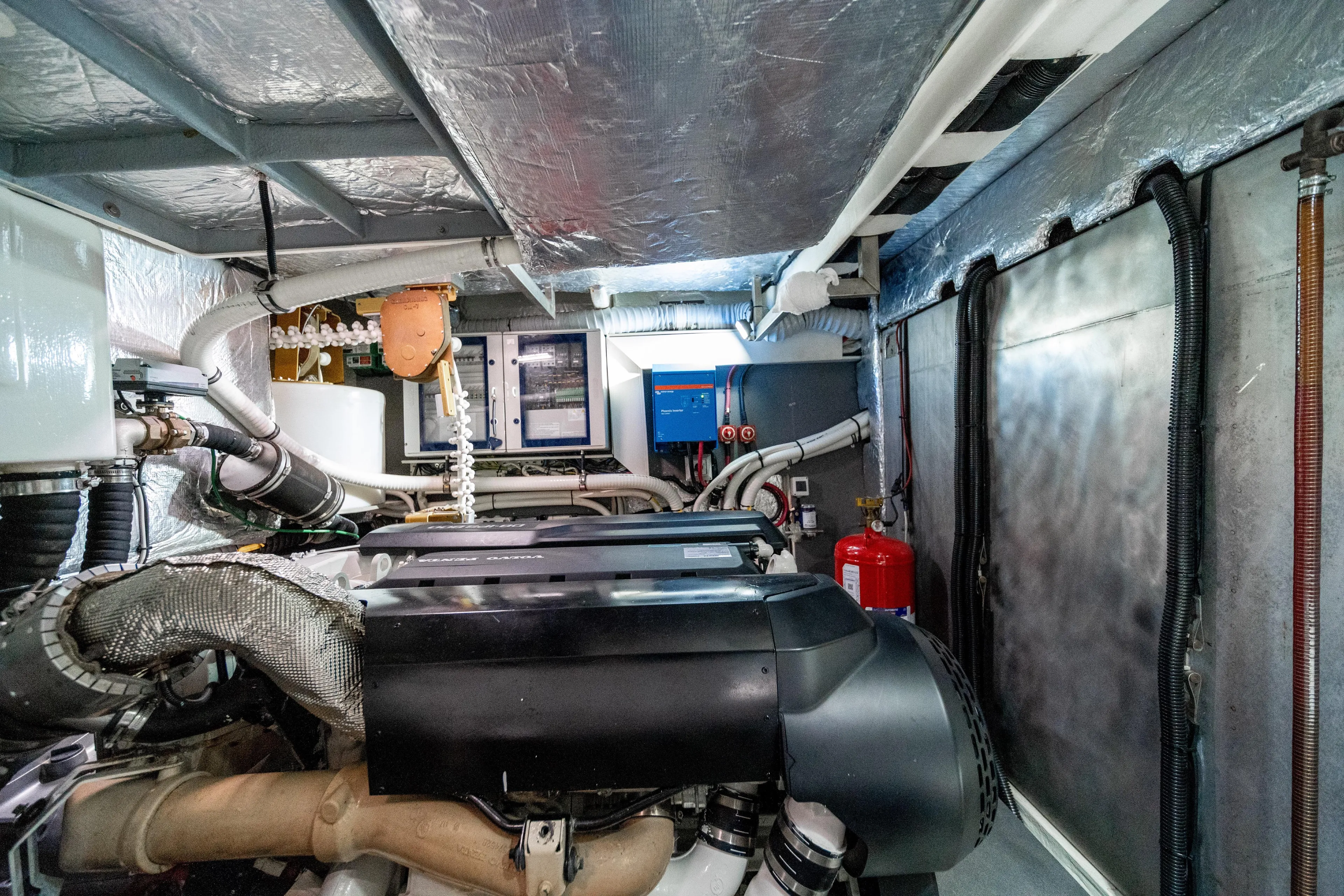 Forever Young Yacht Photos Pics Engine room of 2018 Absolute 58 Navetta yacht, showcasing machinery and equipment.