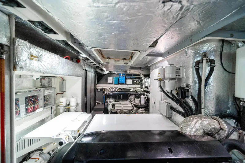 Forever Young Yacht Photos Pics Engine room of 2018 Absolute 58 Navetta yacht, showcasing machinery and equipment.