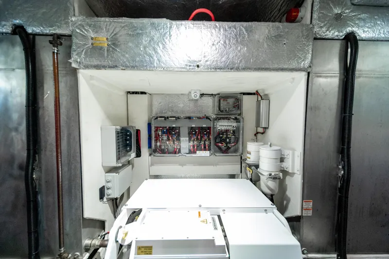 Forever Young Yacht Photos Pics Engine room of 2018 Absolute 58 Navetta yacht with electrical panels and equipment.