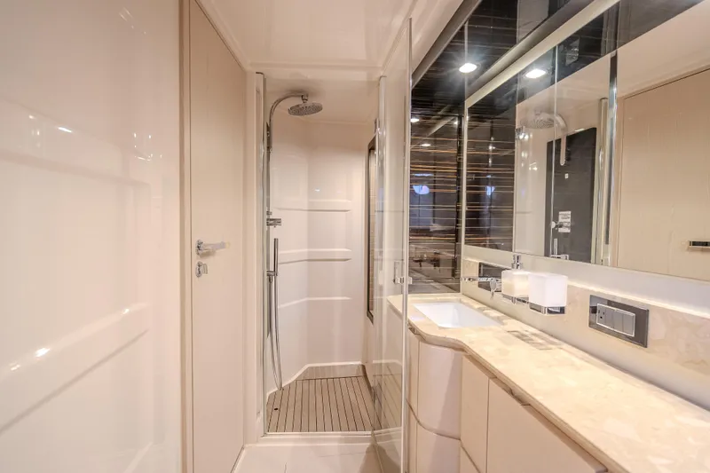  Yacht Photos Pics Luxurious bathroom interior of 2019 Azimut 66 yacht with modern shower and sleek design.