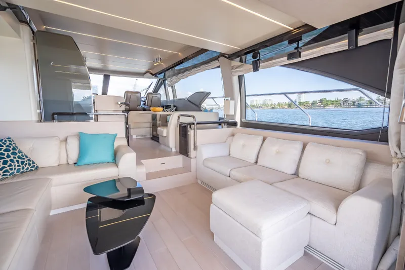  Yacht Photos Pics Luxurious interior of 2019 Azimut 66 yacht with elegant seating and panoramic windows.