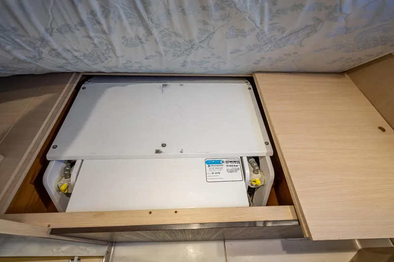  Yacht Photos Pics Hidden storage compartment in 2019 Azimut 66 yacht interior.