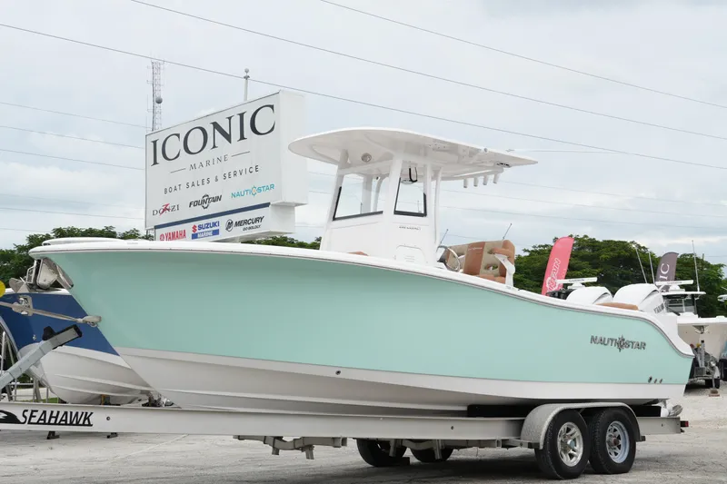 Yacht Photos Pics 2025 NauticStar 252 Legacy boat on trailer at Iconic Marine dealership.