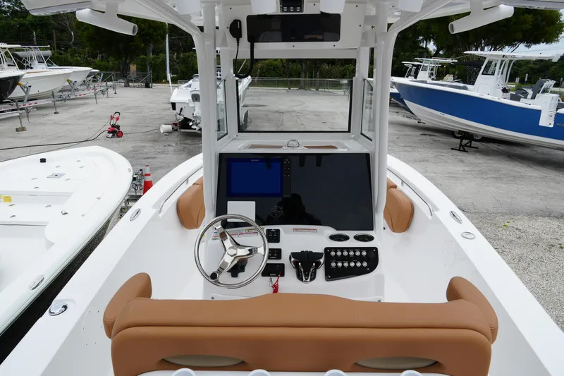  Yacht Photos Pics 2025 NauticStar 252 Legacy boat interior with modern helm and tan seating.