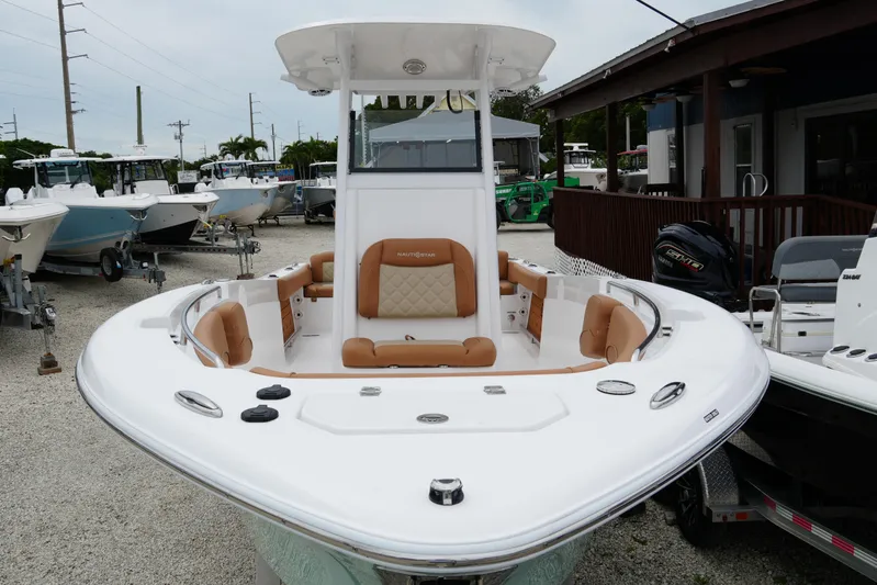  Yacht Photos Pics 2025 NauticStar 252 Legacy boat with tan seating, displayed outdoors.