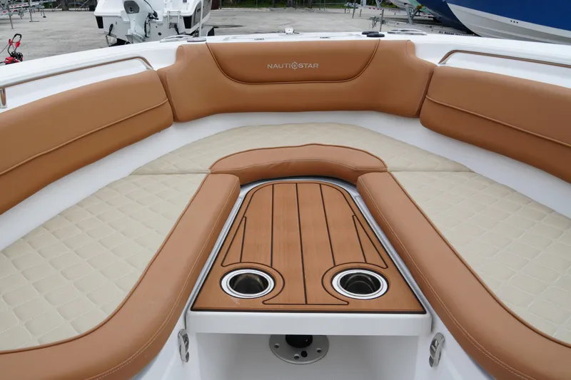  Yacht Photos Pics 2025 NauticStar 252 Legacy boat interior with tan seating and wood accents.