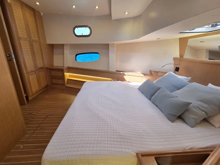  Yacht Photos Pics Luxurious cabin interior of 2025 Sasga Yachts Menorquin 48 with wooden finishes and ocean view.