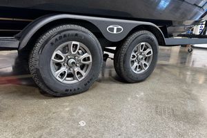 2026 Tahoe T21 trailer with dual Karrier tires on polished concrete floor.