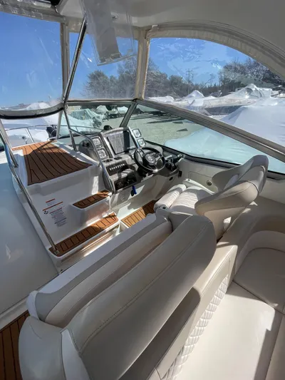  Yacht Photos Pics 2018 Chaparral 310 Signature boat interior with modern dashboard and seating.