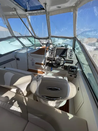  Yacht Photos Pics 2018 Chaparral 310 Signature boat cockpit with modern controls and seating.