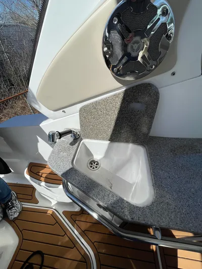  Yacht Photos Pics 2018 Chaparral 310 Signature boat sink with speaker and wood flooring.