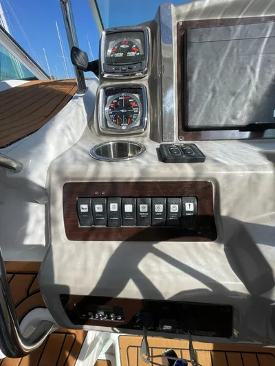  Yacht Photos Pics Control panel of a 2018 Chaparral 310 Signature boat with gauges and switches.
