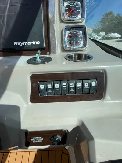  Yacht Photos Pics Control panel of 2018 Chaparral 310 Signature boat with gauges and switches.