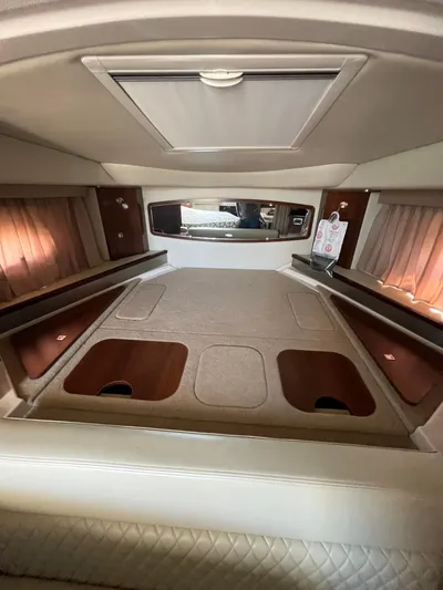  Yacht Photos Pics Interior cabin of 2018 Chaparral 310 Signature boat, featuring cozy sleeping area.
