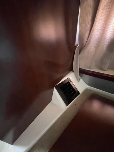  Yacht Photos Pics Interior of 2018 Chaparral 310 Signature boat with wood paneling and vent.