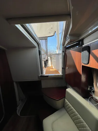  Yacht Photos Pics Interior view of 2018 Chaparral 310 Signature yacht, featuring seating and cabinetry.