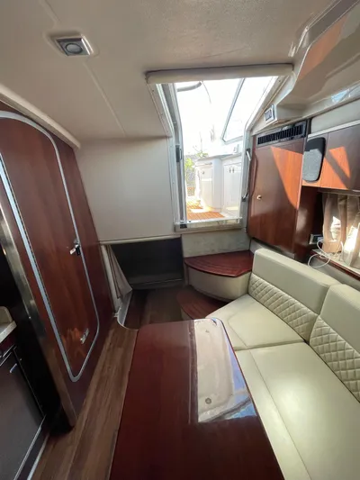  Yacht Photos Pics 2018 Chaparral 310 Signature interior with elegant seating and wood finishes.