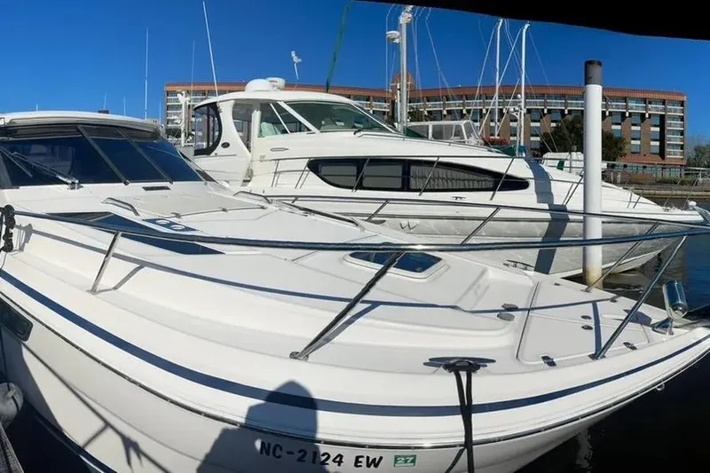  Yacht Photos Pics 2020 Regal 35 Sport Coupe docked at marina with clear blue sky.