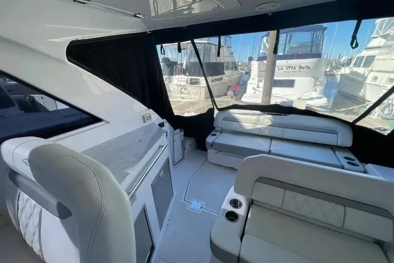  Yacht Photos Pics Interior of a 2020 Regal 35 Sport Coupe yacht with luxurious seating and marina view.