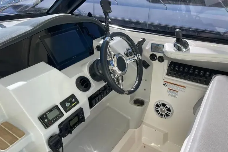  Yacht Photos Pics 2020 Regal 35 Sport Coupe helm with steering wheel and control panel.