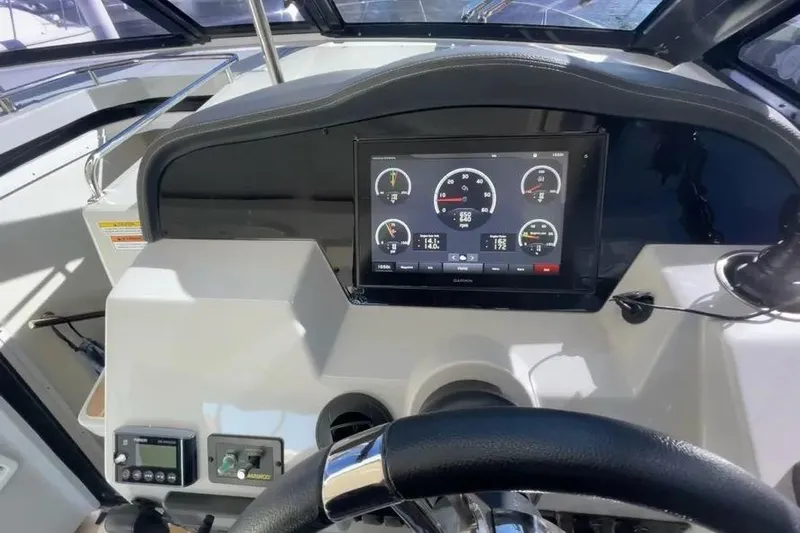  Yacht Photos Pics 2020 Regal 35 Sport Coupe dashboard with digital display and steering wheel.