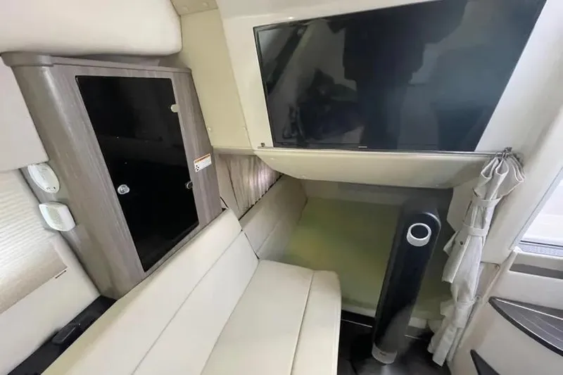  Yacht Photos Pics Interior of 2020 Regal 35 Sport Coupe with TV and seating area.