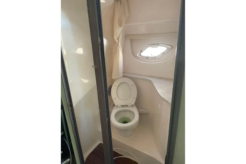  Yacht Photos Pics 2020 Regal 35 Sport Coupe bathroom with toilet and porthole window.