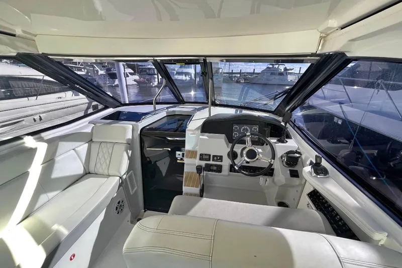  Yacht Photos Pics 2020 Regal 35 Sport Coupe interior cockpit with modern controls and luxurious seating.