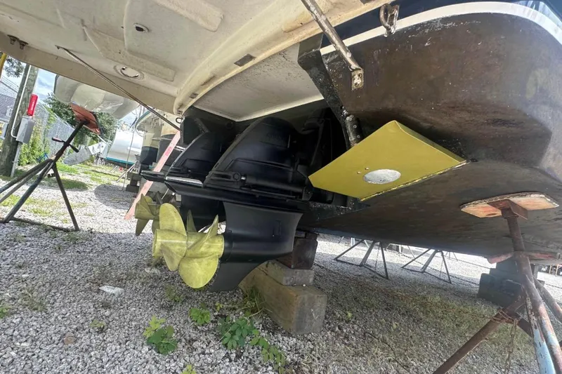 Yacht Photos Pics Underneath view of a 2020 Regal 35 Sport Coupe boat on stands, showing propellers.