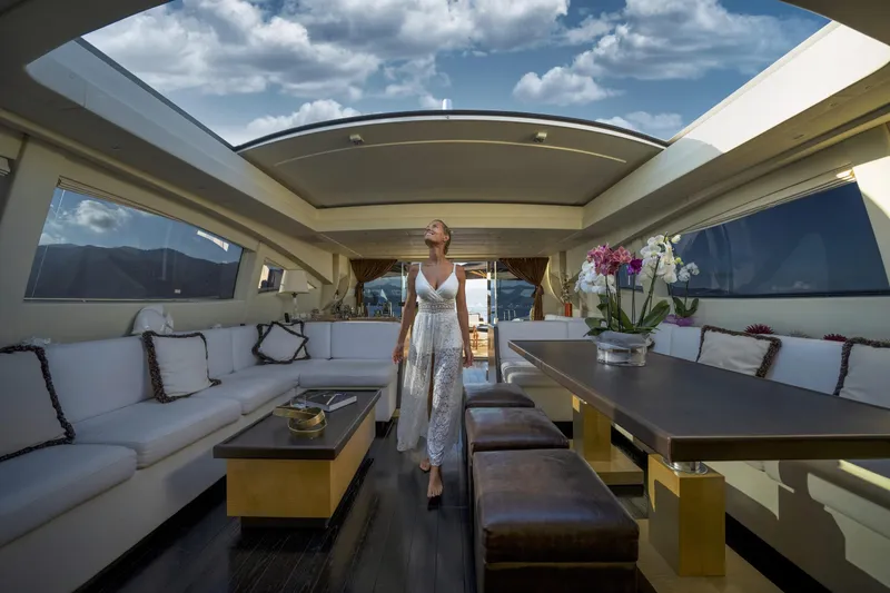 Manu Yacht Photos Pics Luxurious interior of 2006 Mangusta 92 yacht with elegant decor and scenic views.