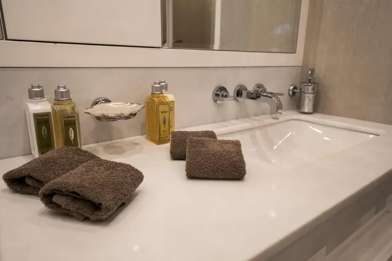 Manu Yacht Photos Pics Luxurious bathroom sink with toiletries and towels on a Mangusta 92 yacht, 2006 model.