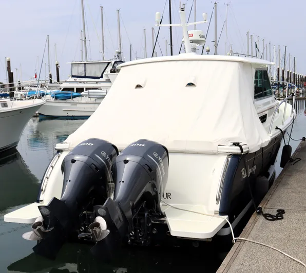 Polo Lounge Yacht Photos Pics 2020 Back Cove 34O boat docked with twin Yamaha outboard engines.