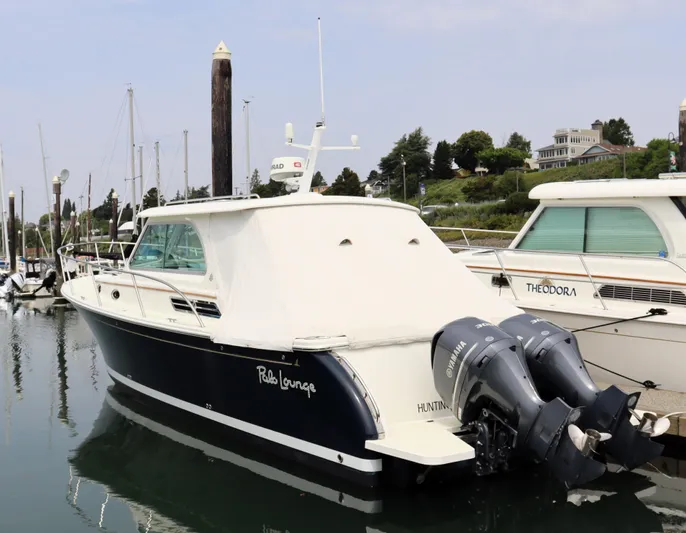 Polo Lounge Yacht Photos Pics 2020 Back Cove 34O boat docked with twin Yamaha outboard engines.