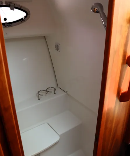 Polo Lounge Yacht Photos Pics 2020 Back Cove 34O boat interior with compact bathroom and shower.
