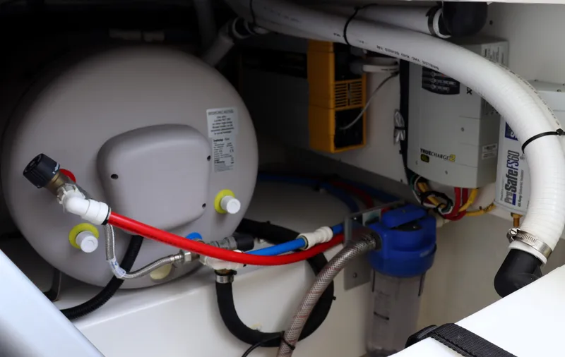 Polo Lounge Yacht Photos Pics Engine room of 2020 Back Cove 34O with plumbing and electrical components.