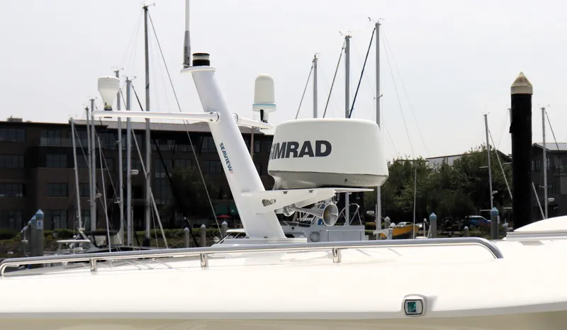Polo Lounge Yacht Photos Pics 2020 Back Cove 34O boat radar system at marina, featuring Simrad equipment.